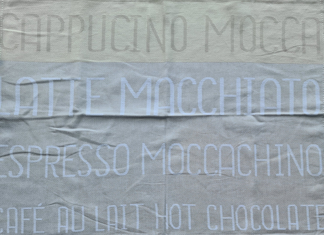 Geschirrtuch, beige mit Beschriftung "Espresso /Cappuccino/ Latte Macchiato /Moccachino /Cafe au lait /hot chocolate" - British Moments