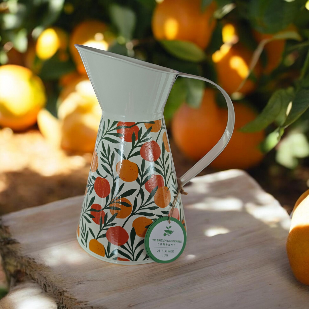 Blechkanne, beige mit Orangen Motiven