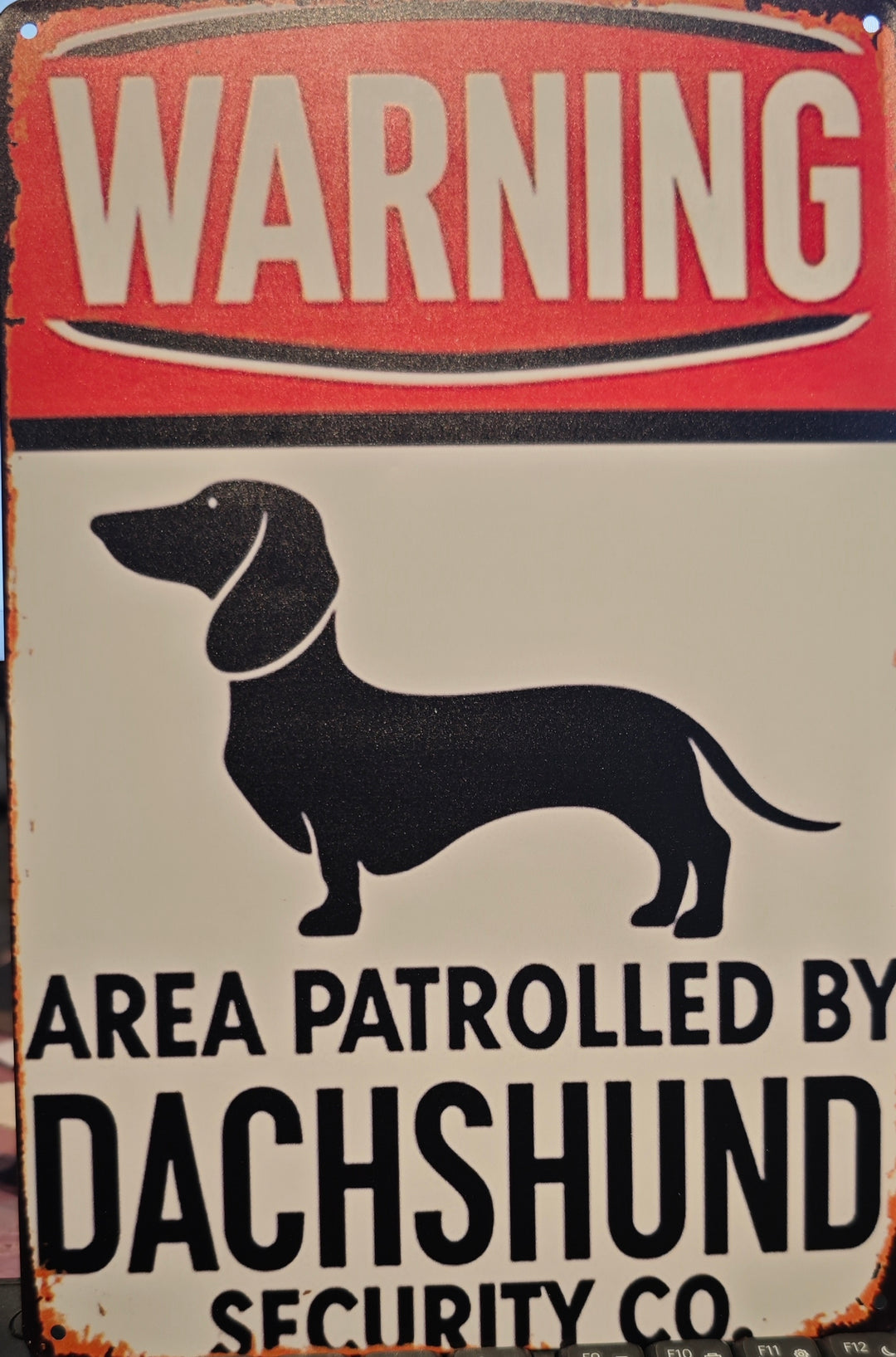 Blechschild "WARNING - Area patrolled by Dachshund Security Co. ."