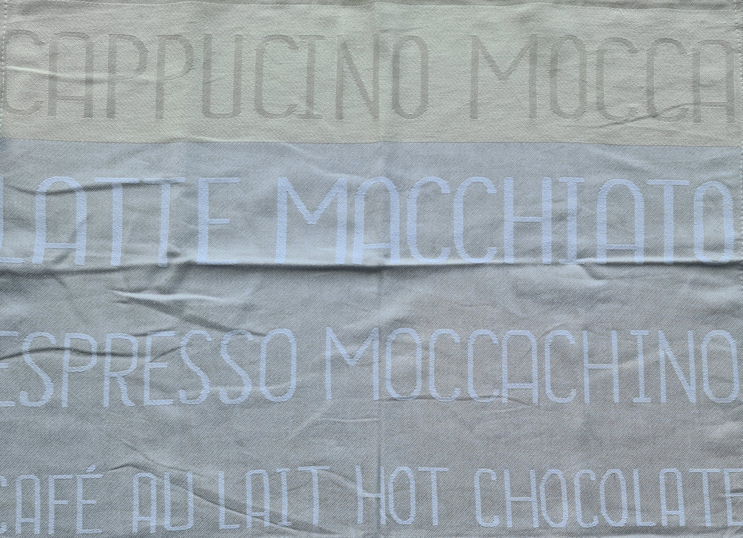 Geschirrtuch, beige  mit Beschriftung "Espresso /Cappuccino/ Latte Macchiato /Moccachino /Cafe au lait /hot chocolate" - British Moments