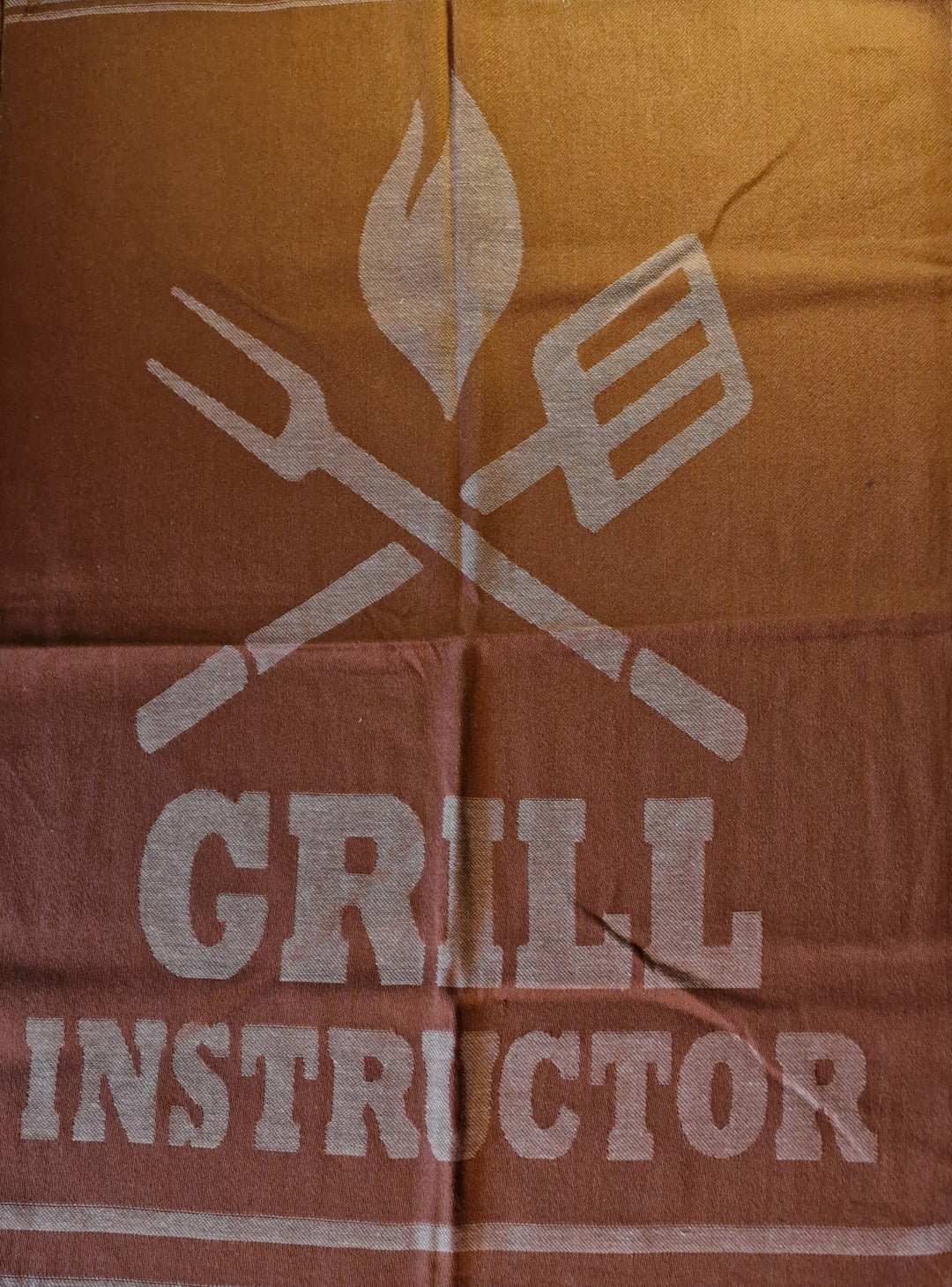 Geschirrtuch, braun  mit Beschriftung "Grill Instructor"